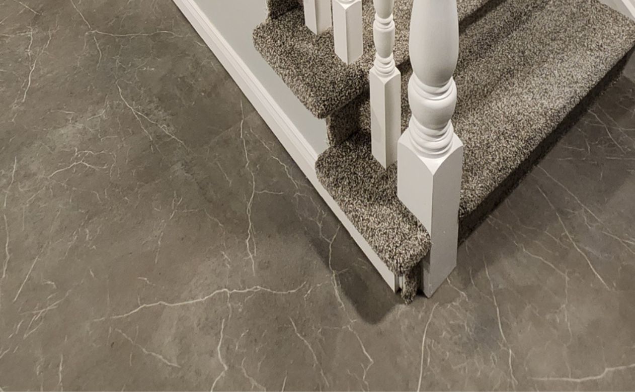 sheet vinyl flooring in a Cayuga, ON, home with carpeted stairs